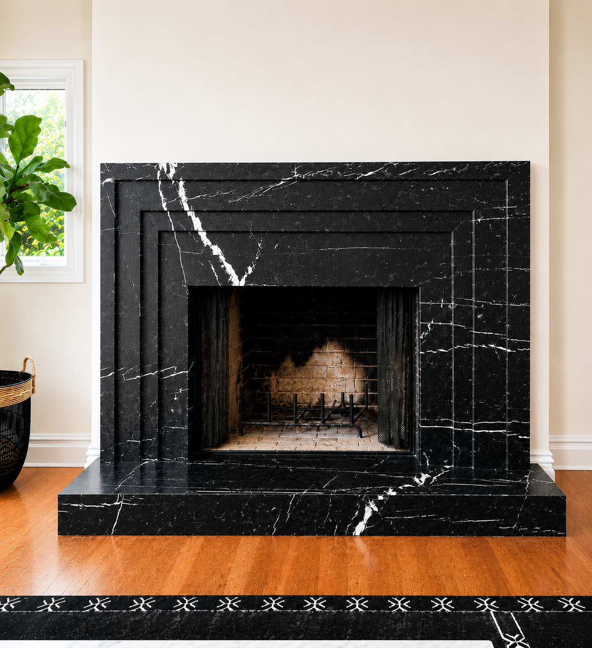 Black marble fireplace surround with bold white veining in a modern living room.
