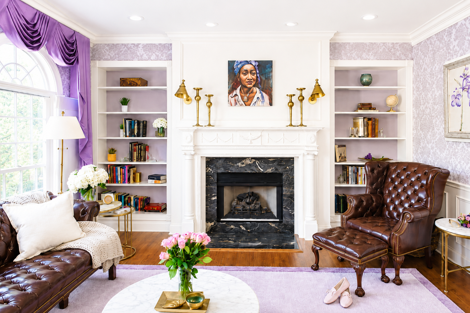 Elegant living room with marble fireplace, built-in shelves, and leather seating.