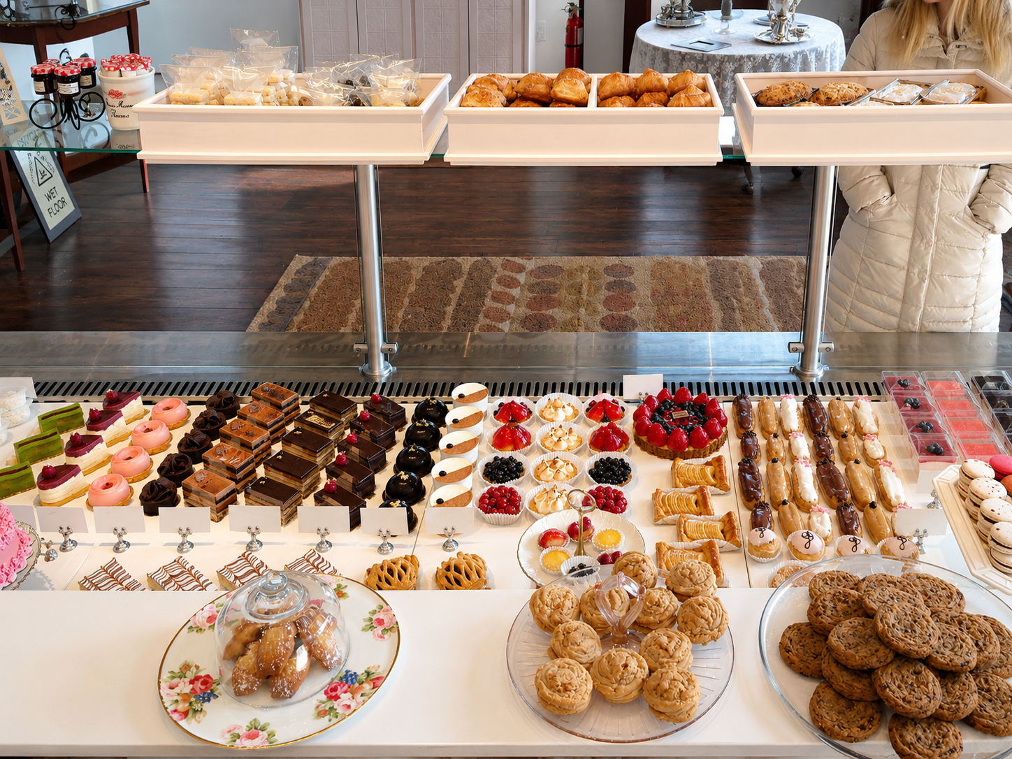 Dessert display with pastries, cakes, cookies, and assorted sweets.