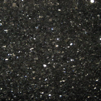 Close-up of polished black granite with fine reflective mineral specks.